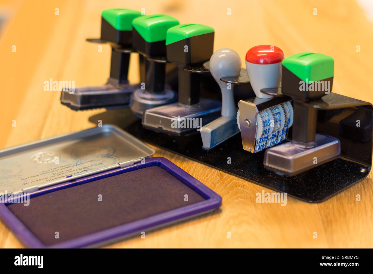 Different Stamp In Stamp Holder, To An Ink Pad Stock Photo Alamy