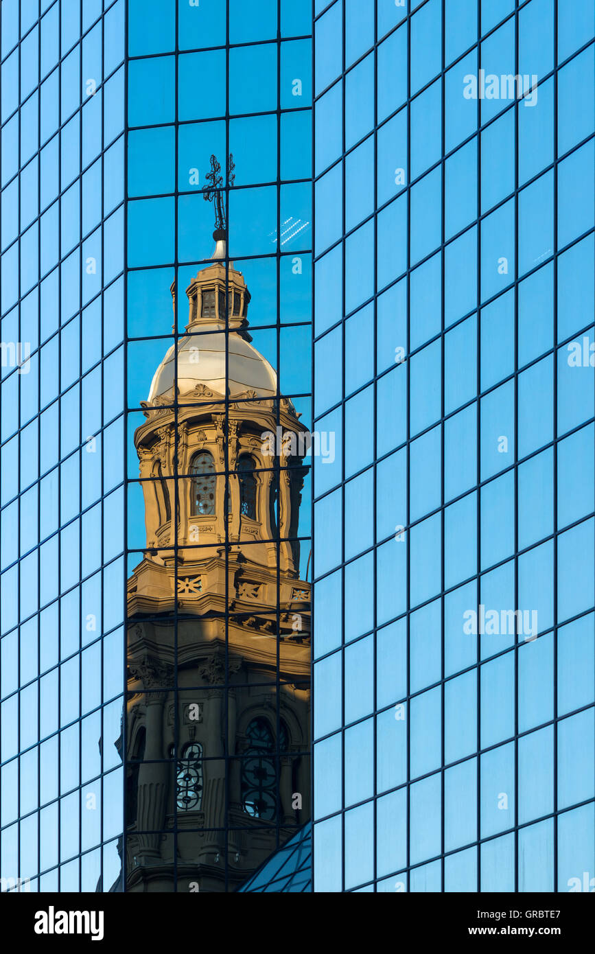 Reflection of the Metropolitan Cathedral in a glass wall in Plaza de Armas, Santiago Stock Photo