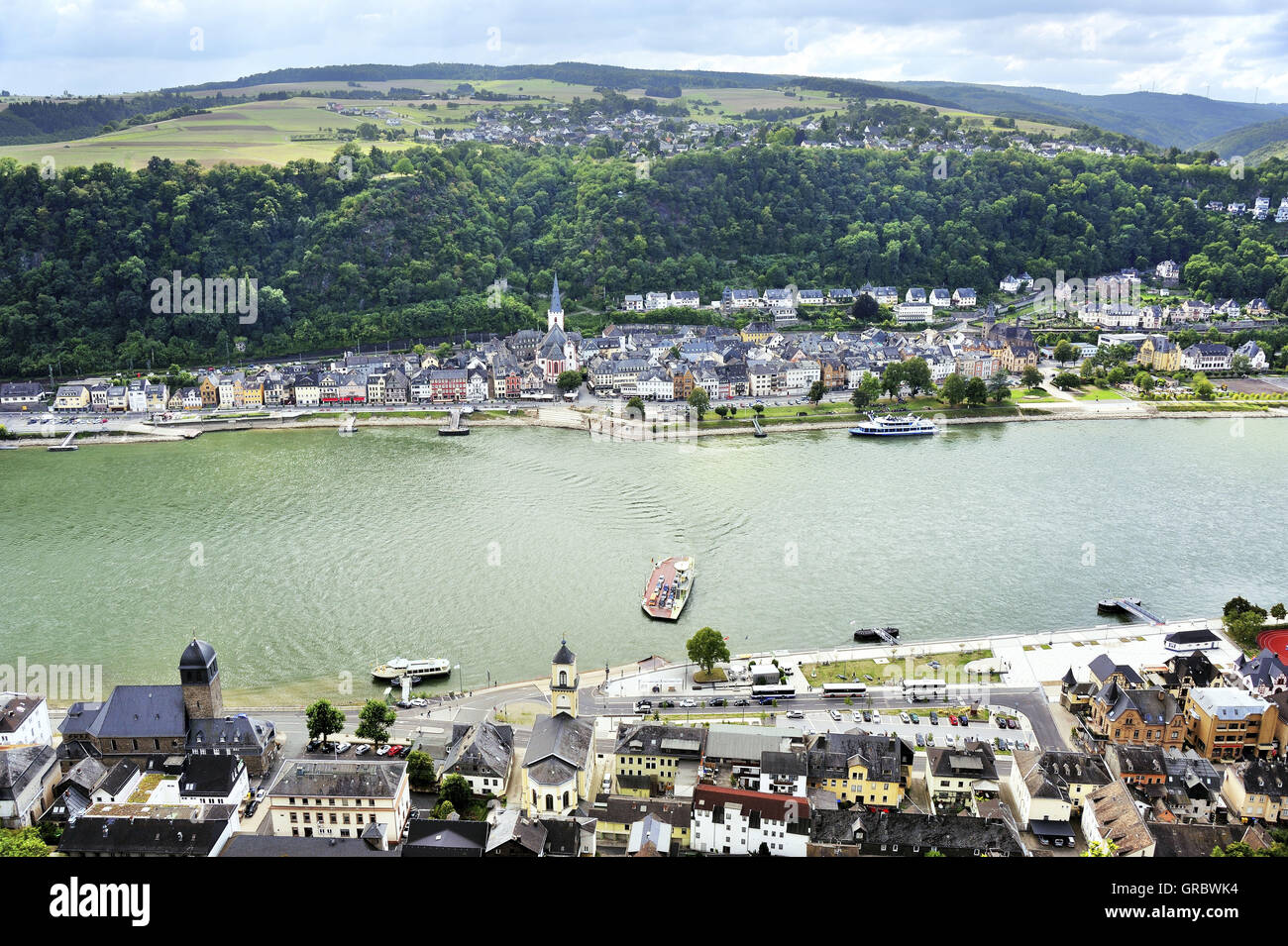 View To The Car Ferry Between The Places Sankt Goar Above And Sankt Goarshausen In The Foreground, Upper Middle Rhine Valley, Germany Stock Photo