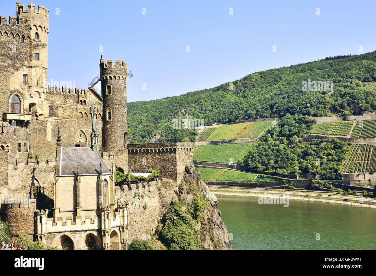 Rheinstein Castle Above The Rhine Near The Town Of Trechtingshausen And Terraced Vines, Upper Middle Rhine Valley, Germany Stock Photo