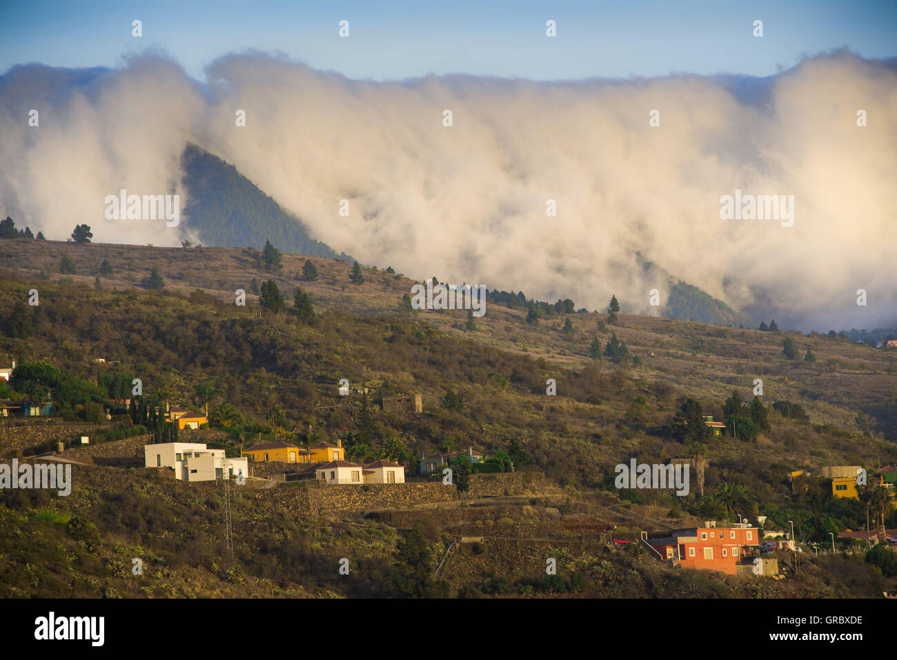The Clouds Of The Tradewind Spill Like A Cascade Over The Cumbre Nueva, La Palma, Canary Islands Stock Photo