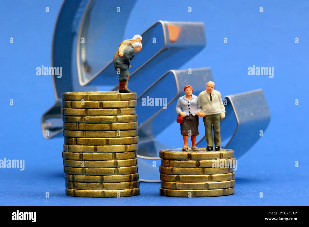 Senior Citizen Standing On Coins With Euro Sign Stock Photo