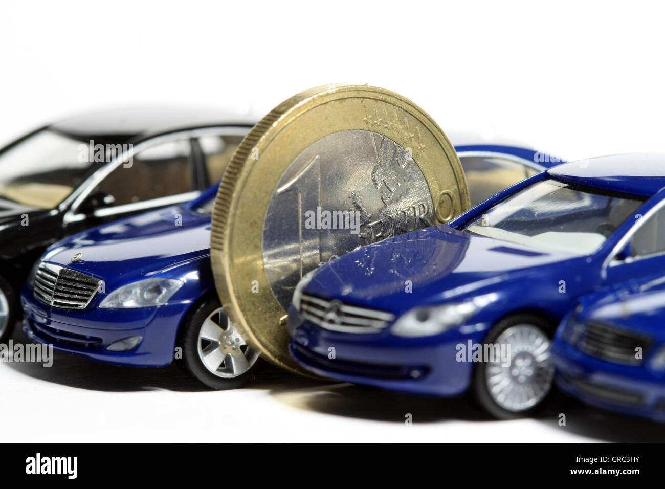 Euro Coin And Luxury Cars Stock Photo