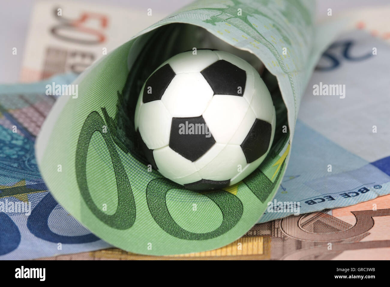 Soccer Ball And Euro Bills Stock Photo