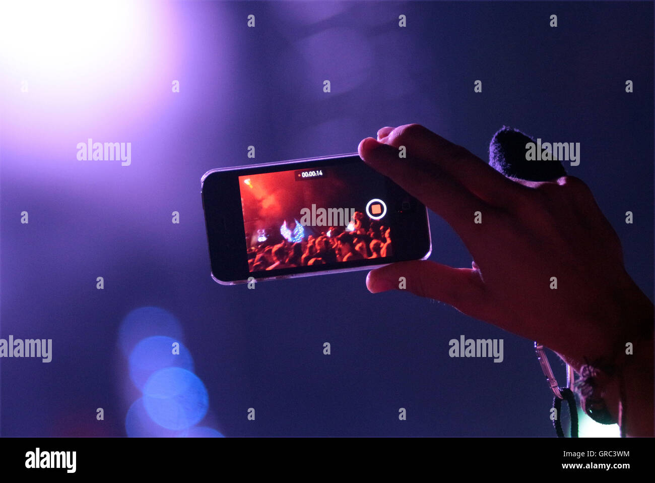 Filming A Music Gig With A Cell Phone Stock Photo - Alamy