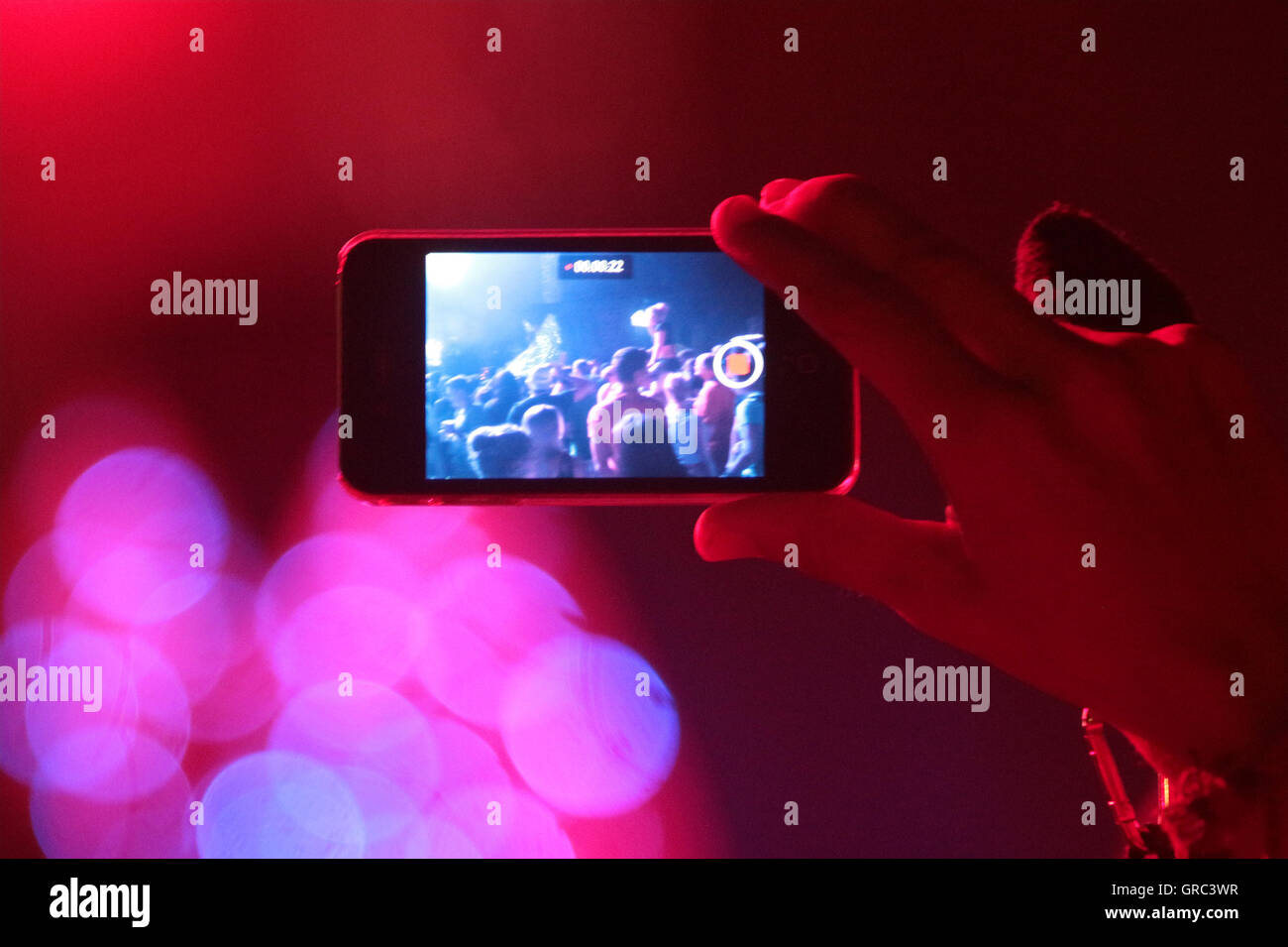 Filming A Music Gig With A Cell Phone Stock Photo - Alamy