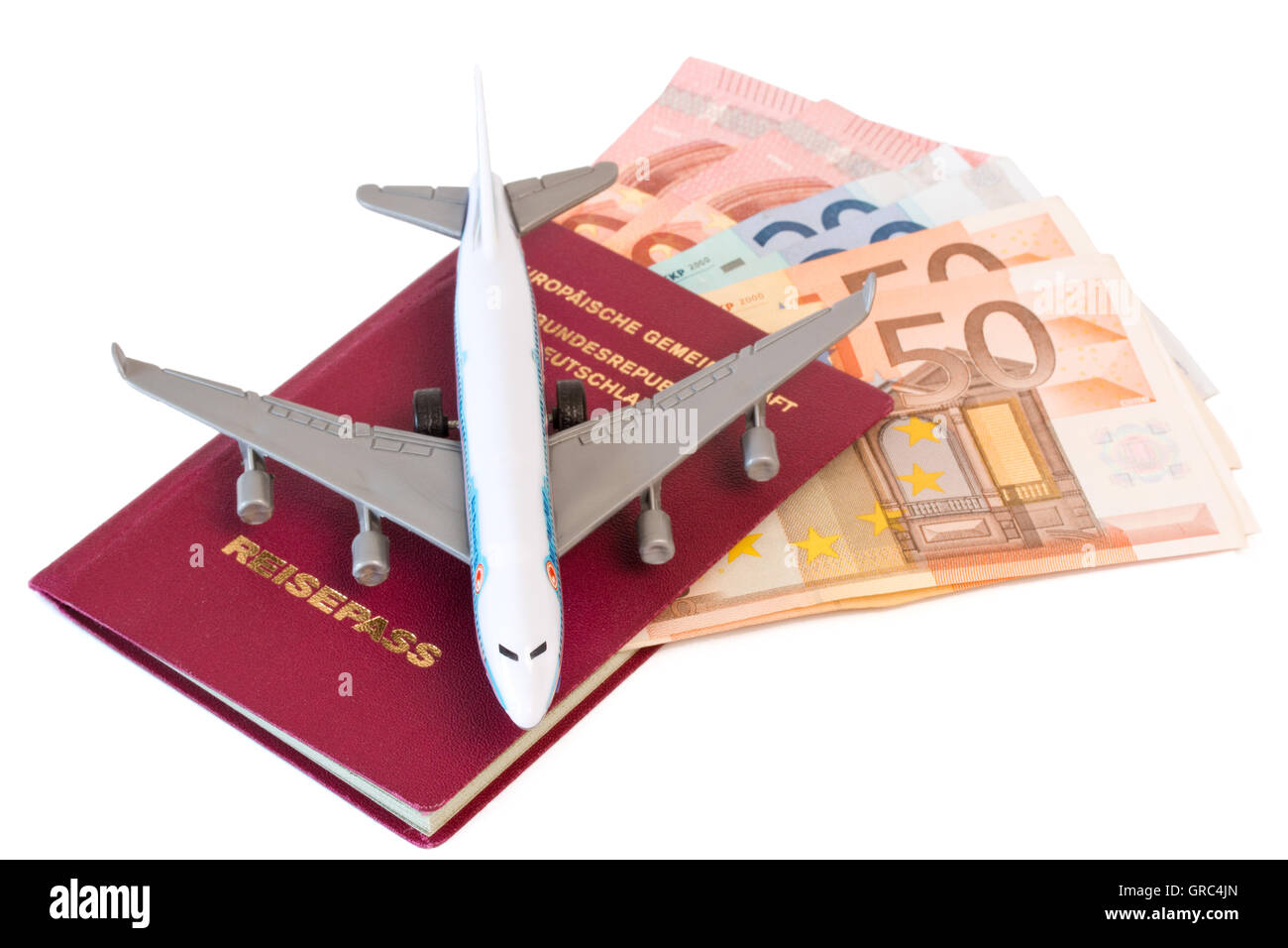 German Passport With Model Airplane And Money Stock Photo