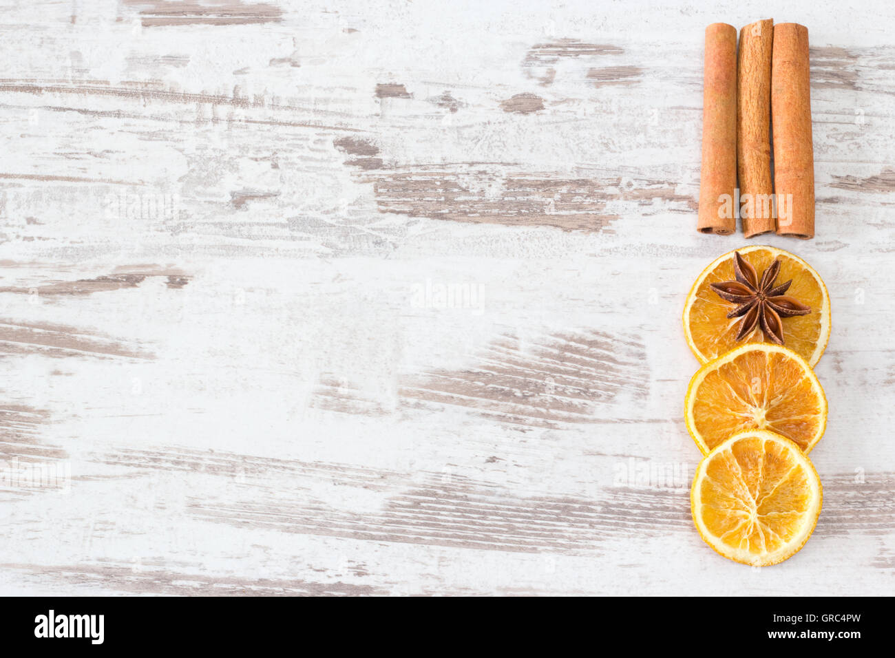 Cinnamon, Anise And Orange Slices On Wooden Background Stock Photo