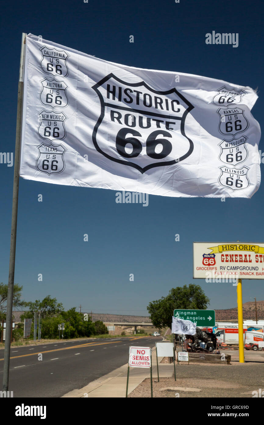 Seligman, Arizona - A flag attracts tourists to souvenir shops that line US Route 66. Stock Photo