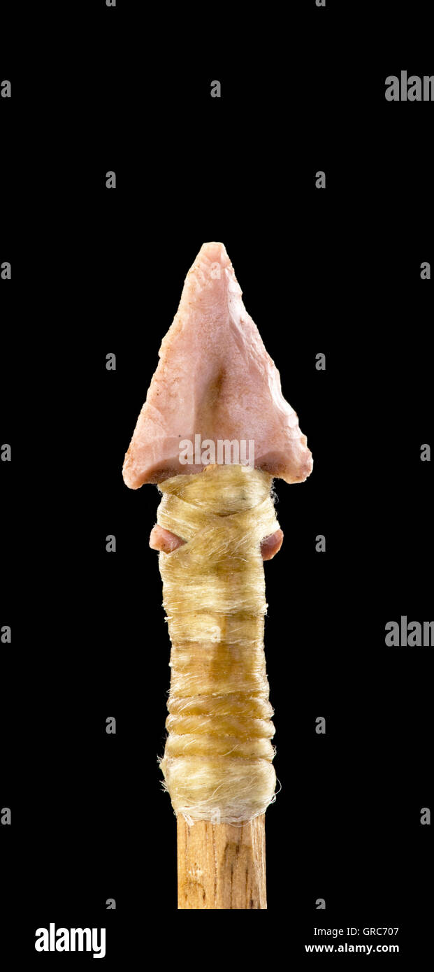 Real American Indian bird point pink flint arrowhead with room for your type. Stock Photo