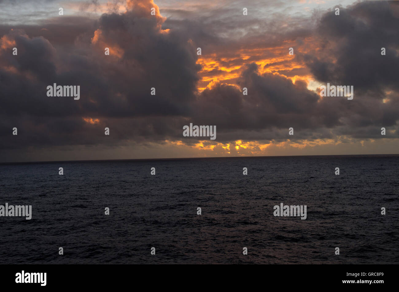 At Sea, ocean and sunset, from cruise ship cabin balcony. Stock Photo