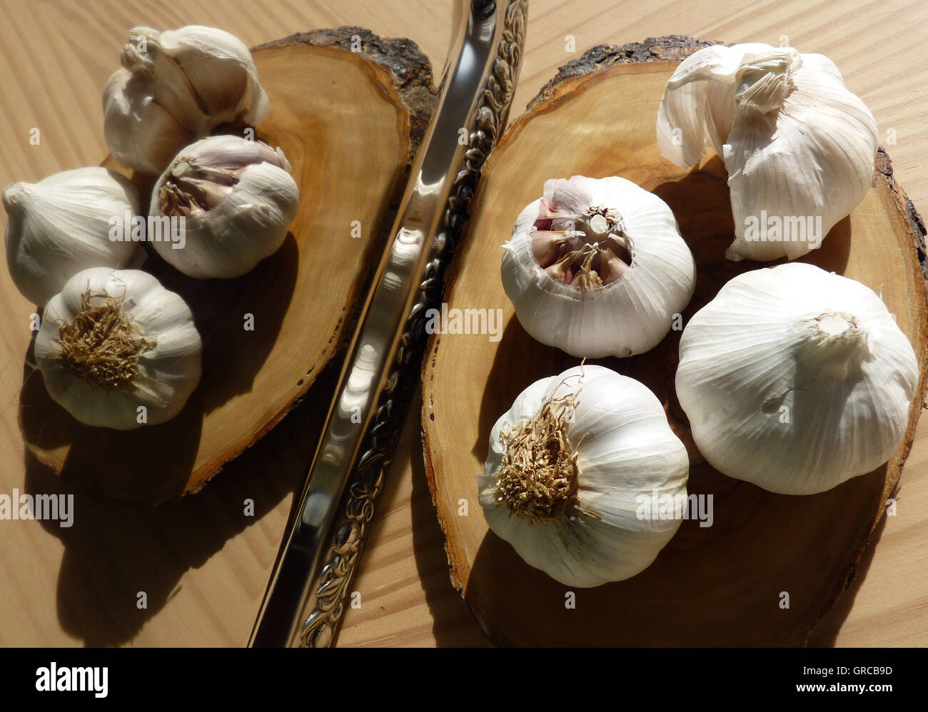 Garlic In Front Of A Mirror, Looks Like A Butterfly Stock Photo