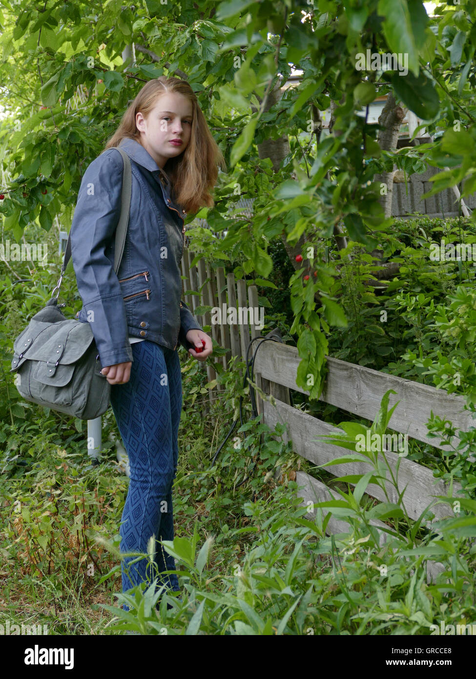 Girl Coming Home From School, In The Countryside Stock Photo