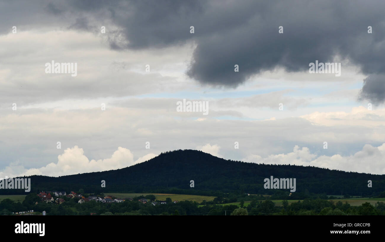 Early Summer 2016, A Storm Follows The Next. Here Dark Clouds Over The Upper Franconian Countryside District Lichtenfels With The Steglitz In Background Stock Photo