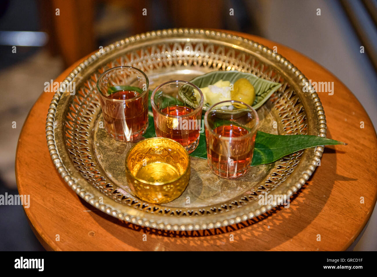 Fancy ya dong Thai white spirits with herbs at a bar in Bangkok, Thailand Stock Photo