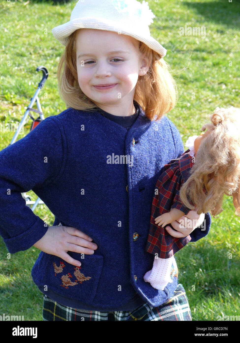 Little Girl Playing With Her Doll Stock Photo - Alamy