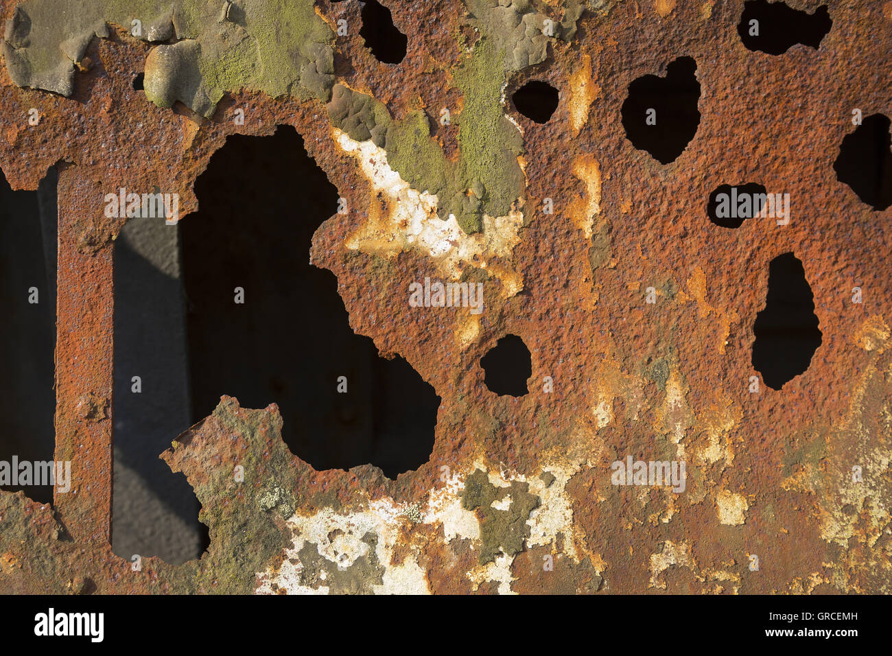 Dripping Rusted Iron Rusted Iron Plate With Paint Residues And Holes Stock Photo - Alamy