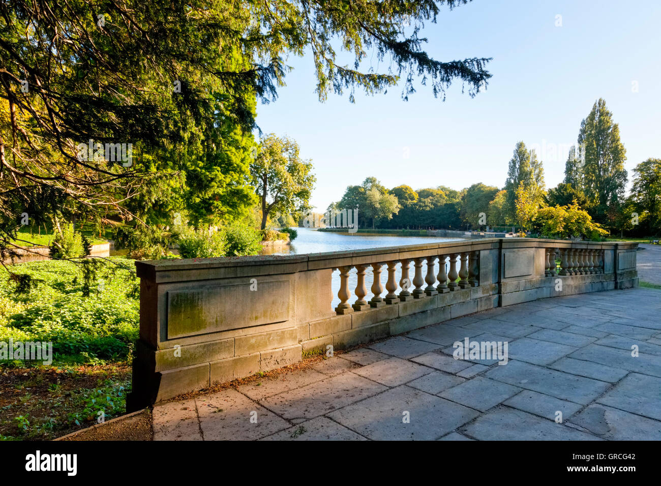 A stone bridge over the lake at Highfields Park, Nottingham, England, UK Stock Photo