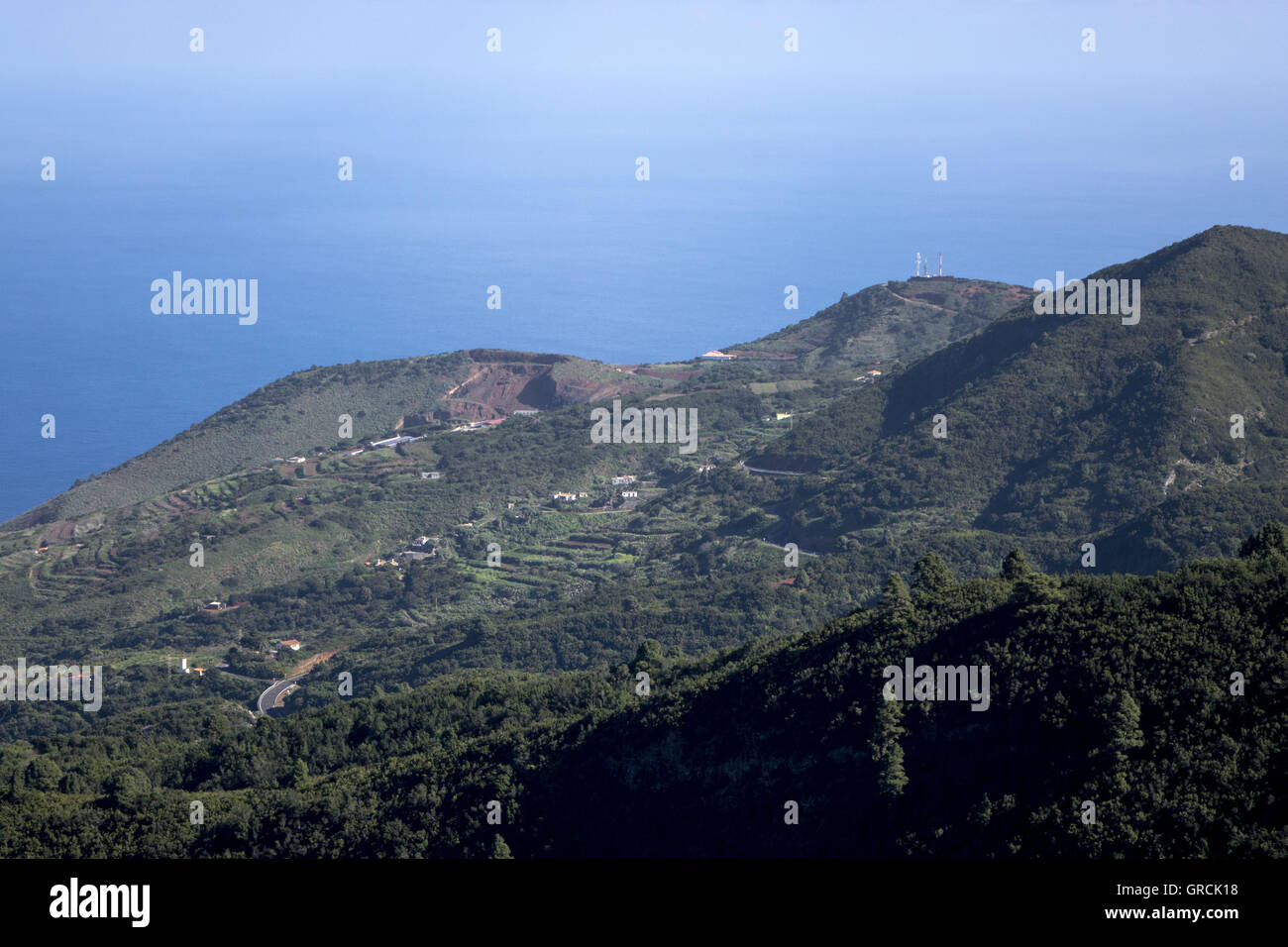 View From A Viewpoint Over Wooded Hills Down To The Atlantic Ocean Nd Blue Sky. Northwestern Part Of The Canary Island La Palma Stock Photo