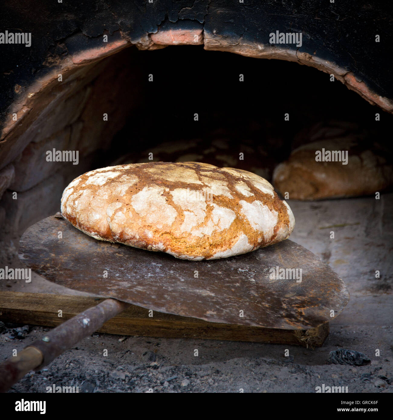 Freshly Baked Bread From The Wood Stove Stock Photo