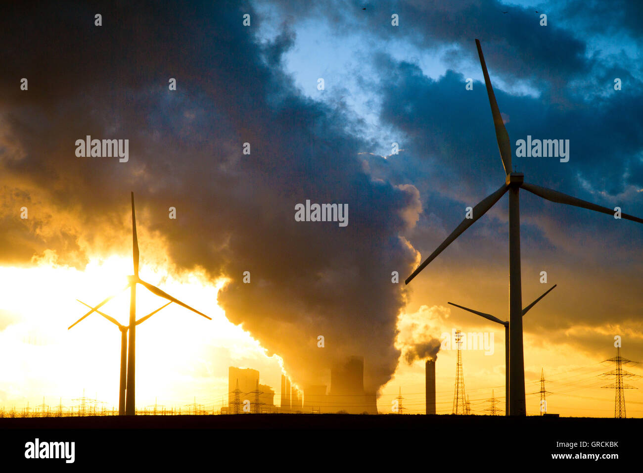 Coal-Fired Power Plant Niederaussem  Nrw Wind Farm In Backlight Stock Photo