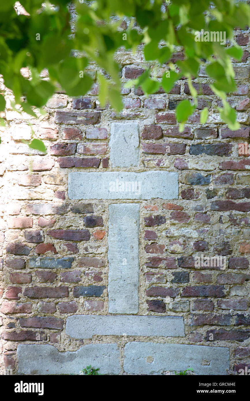 Christian Cross In A Stone Wall Stock Photo