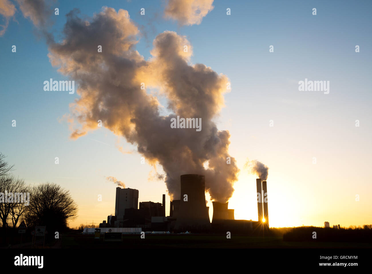 Coal Power Plant Niederaussem Nrw With Refugee Accommodation In Backlight Stock Photo