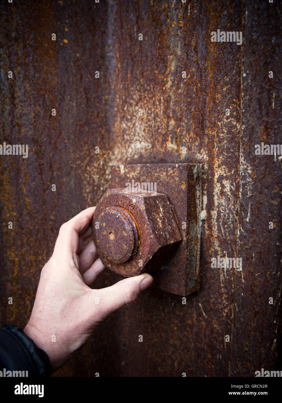 Solve Big Rusty Screw By Hand Stock Photo