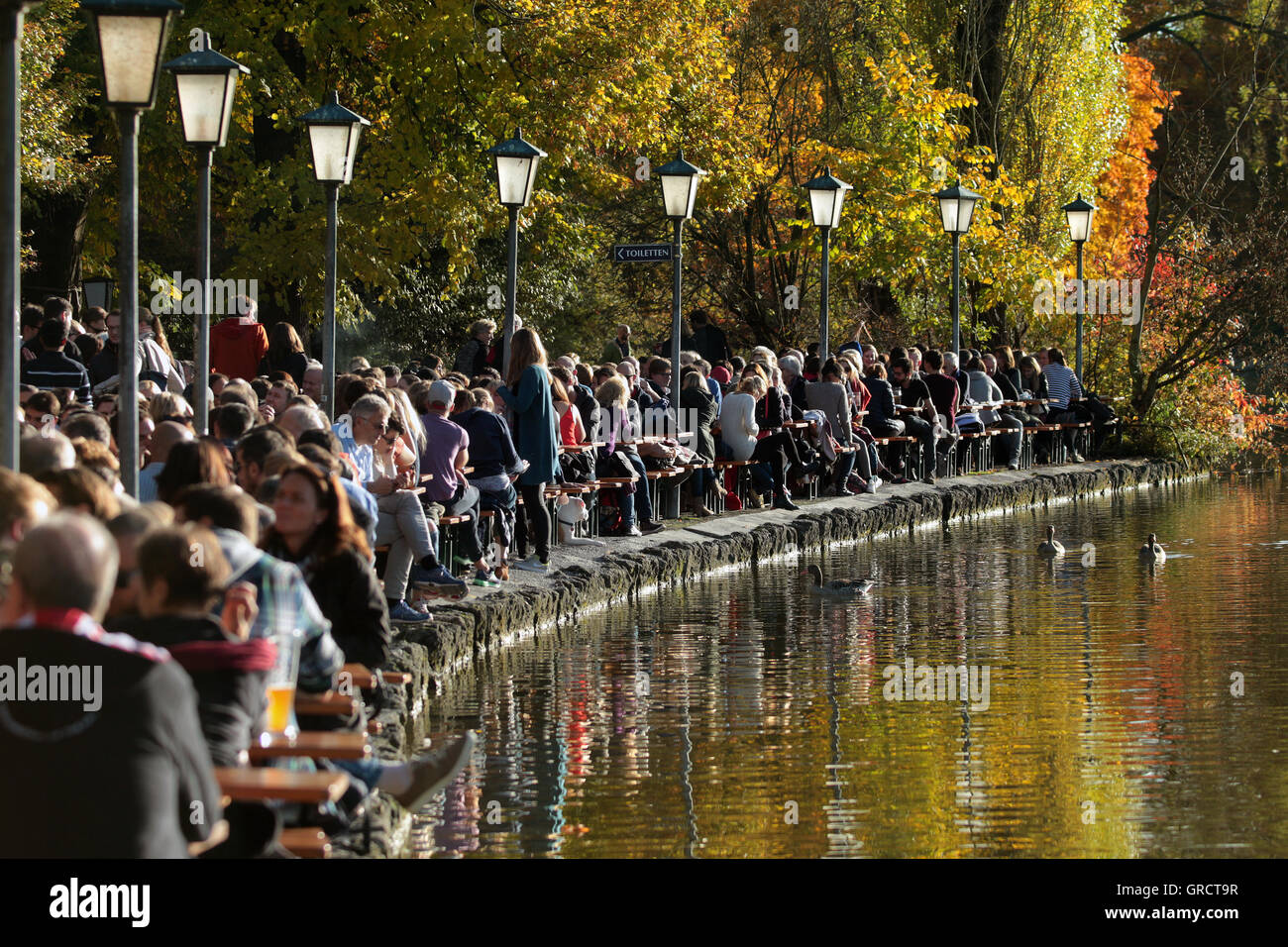 Warm And Sunny Fall Weather Led To Crowd At Beer Garden Seehaus In Munich Stock Photo