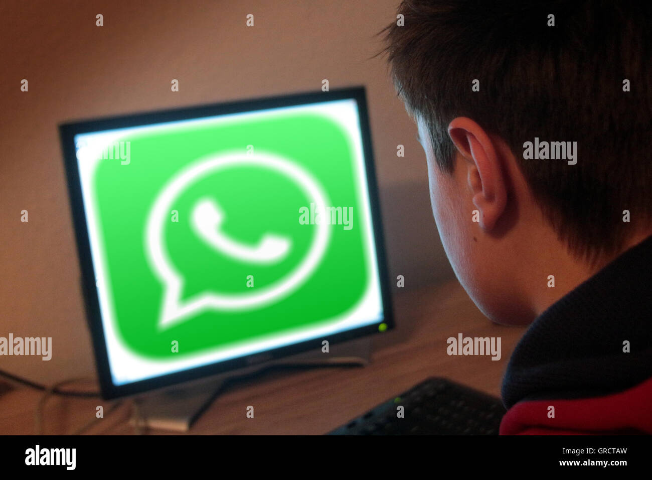 Teenager Surfing On The Web And Using Whatsapp Stock Photo