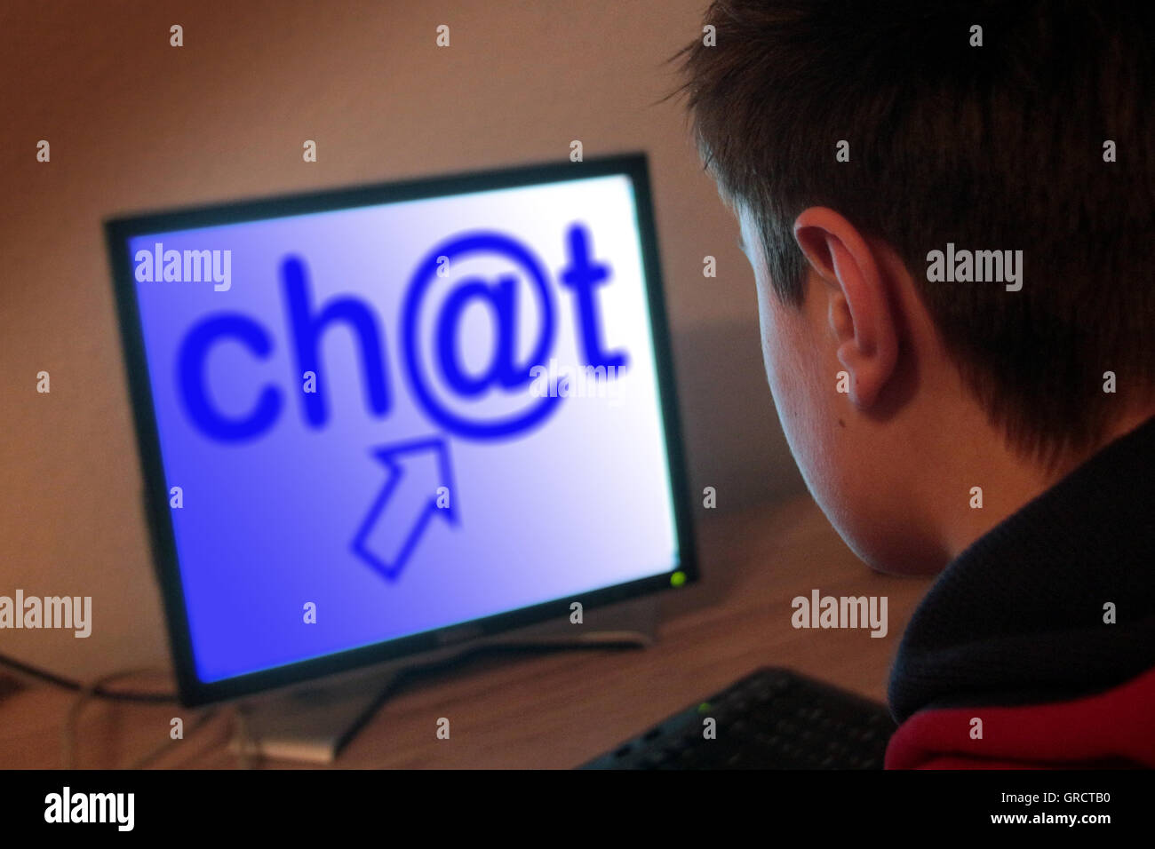 Teenager Surfing On The Web And Using A Chatroom Stock Photo