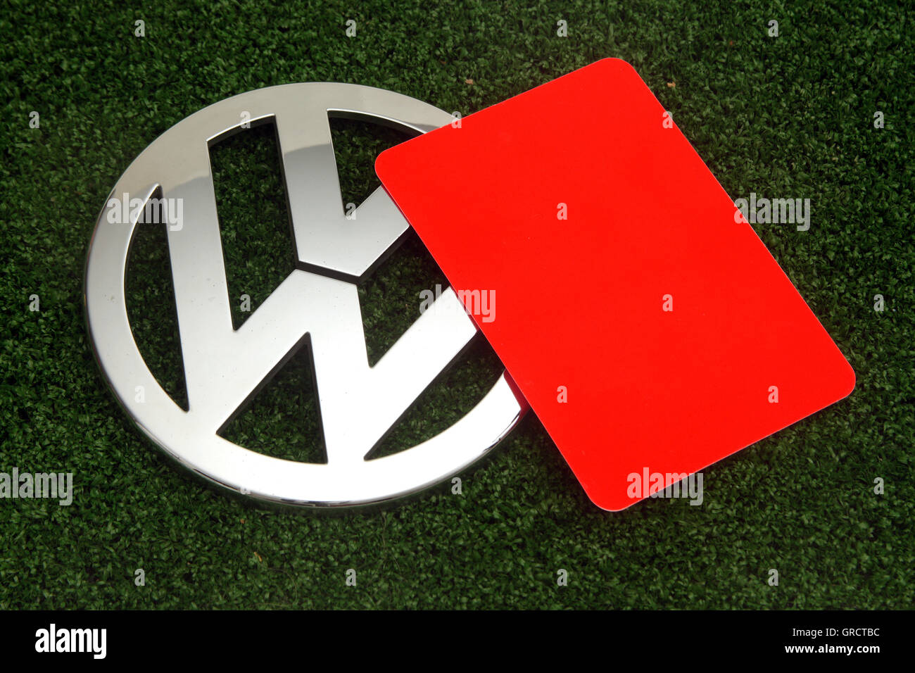 Red Card With Vw Sign On Green Turf Stock Photo
