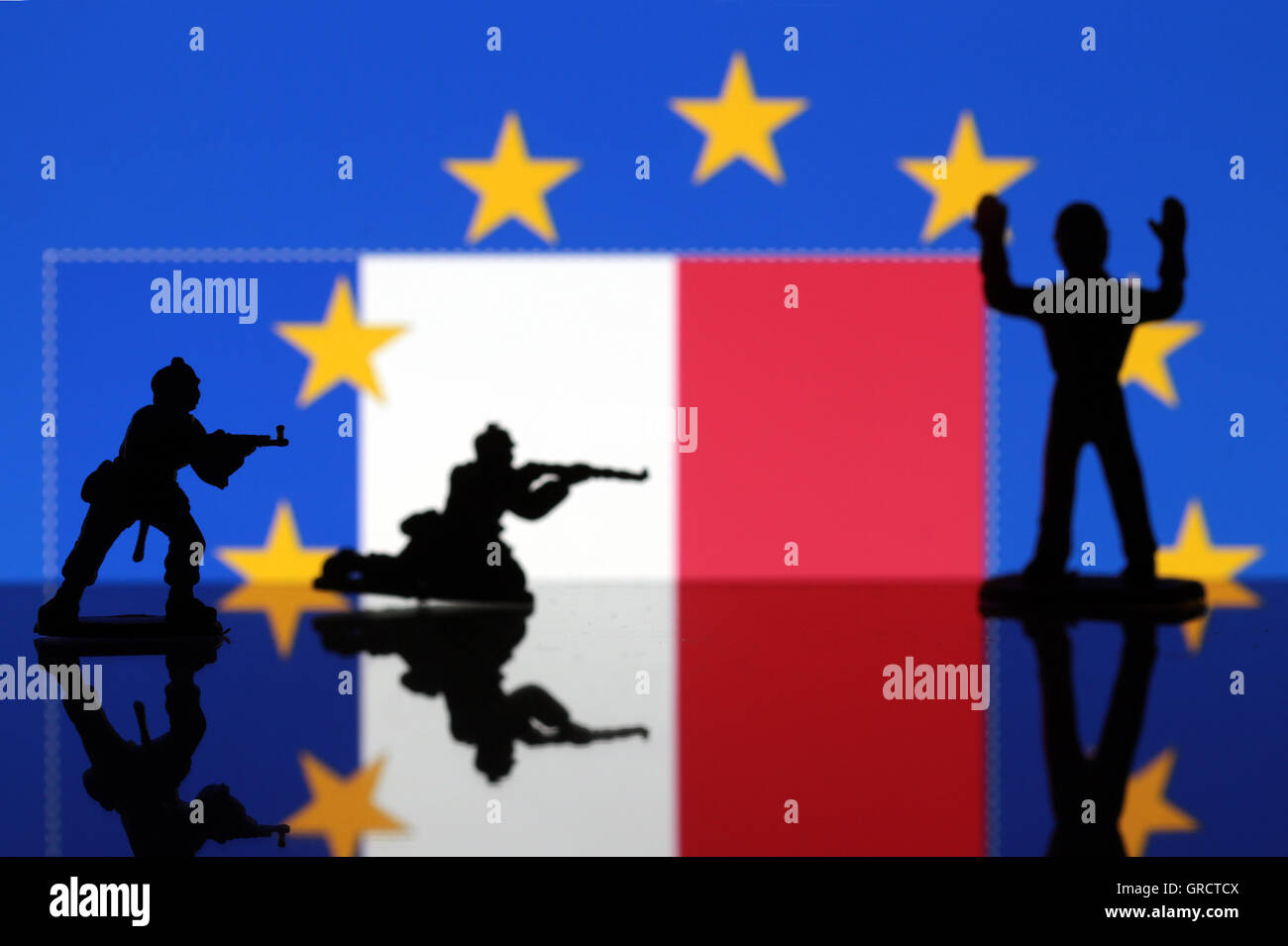 Armed Soldiers And Surrendering Person With Eu And French Flags Stock Photo