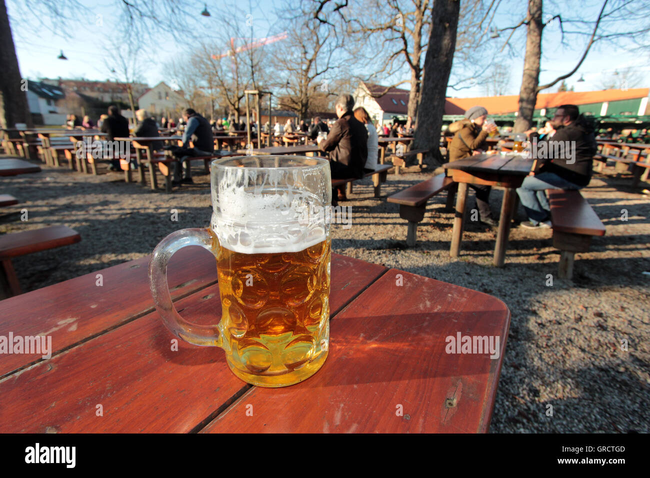 Beer On A Table In A Biergarten During Spring-Like Temperatures At Christmas In Munich Stock Photo