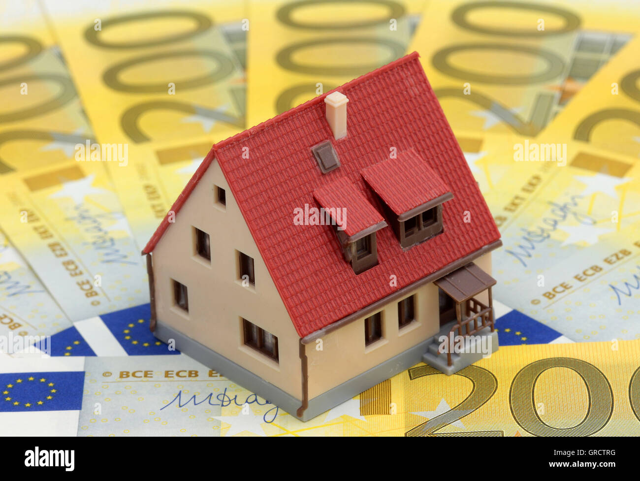 Miniature House On Euro Bills Stock Photo