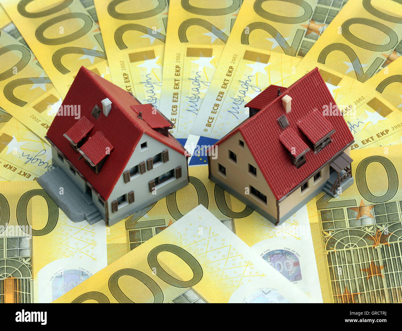 Miniature Houses On Euro Bills Stock Photo
