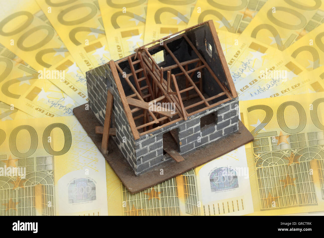 Miniature House Under Construction On Euro Bills Stock Photo