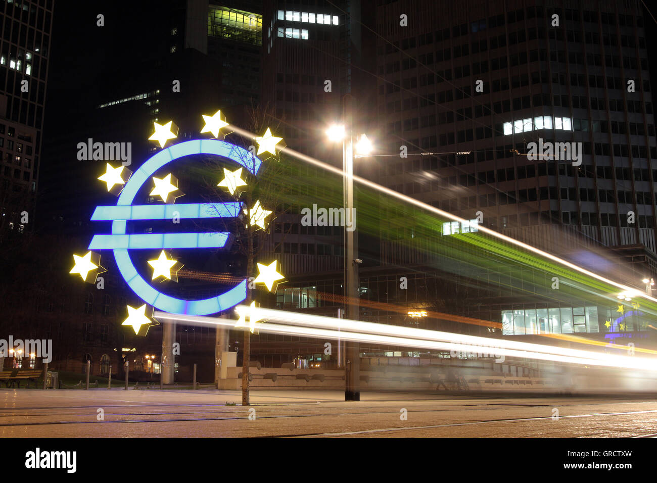 Illuminated Euro Symbol In Frankfurt At Night Stock Photo