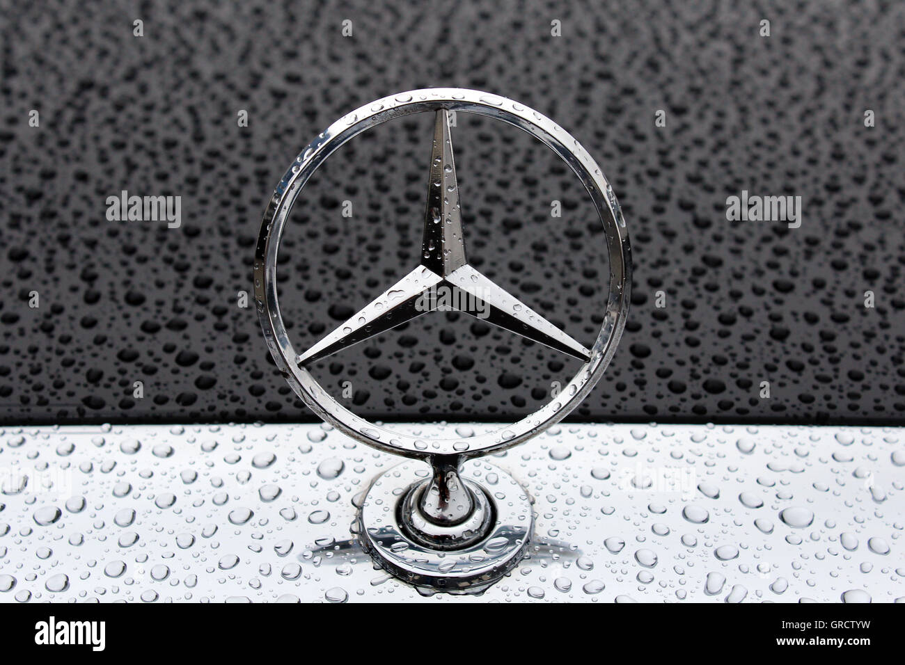 Mercedes Benz Star On Rainy Hood Stock Photo