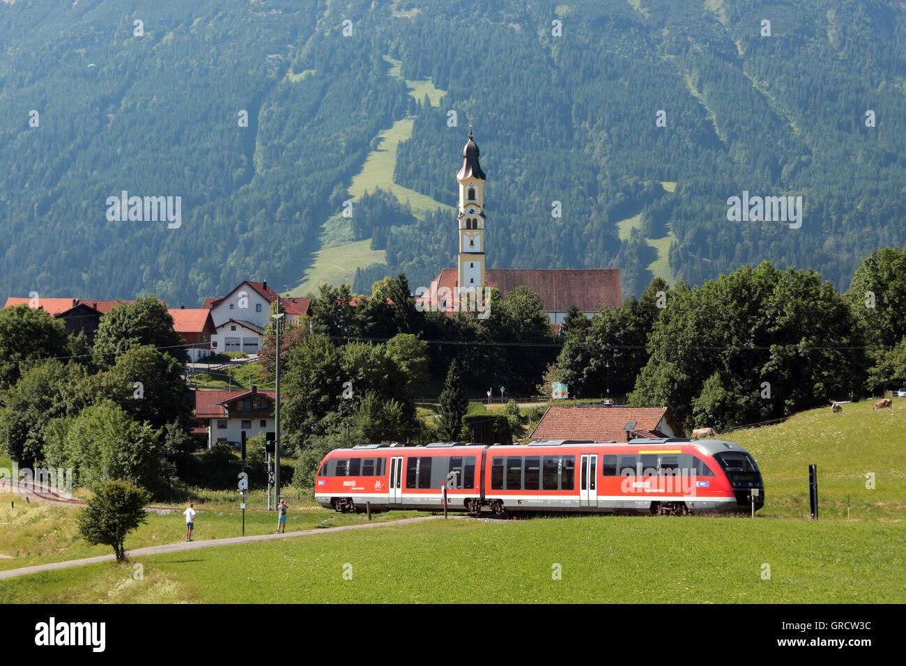 Regional Commuter Train Leaving Pfronten, Bavarian Region Of Allgaeu Stock Photo