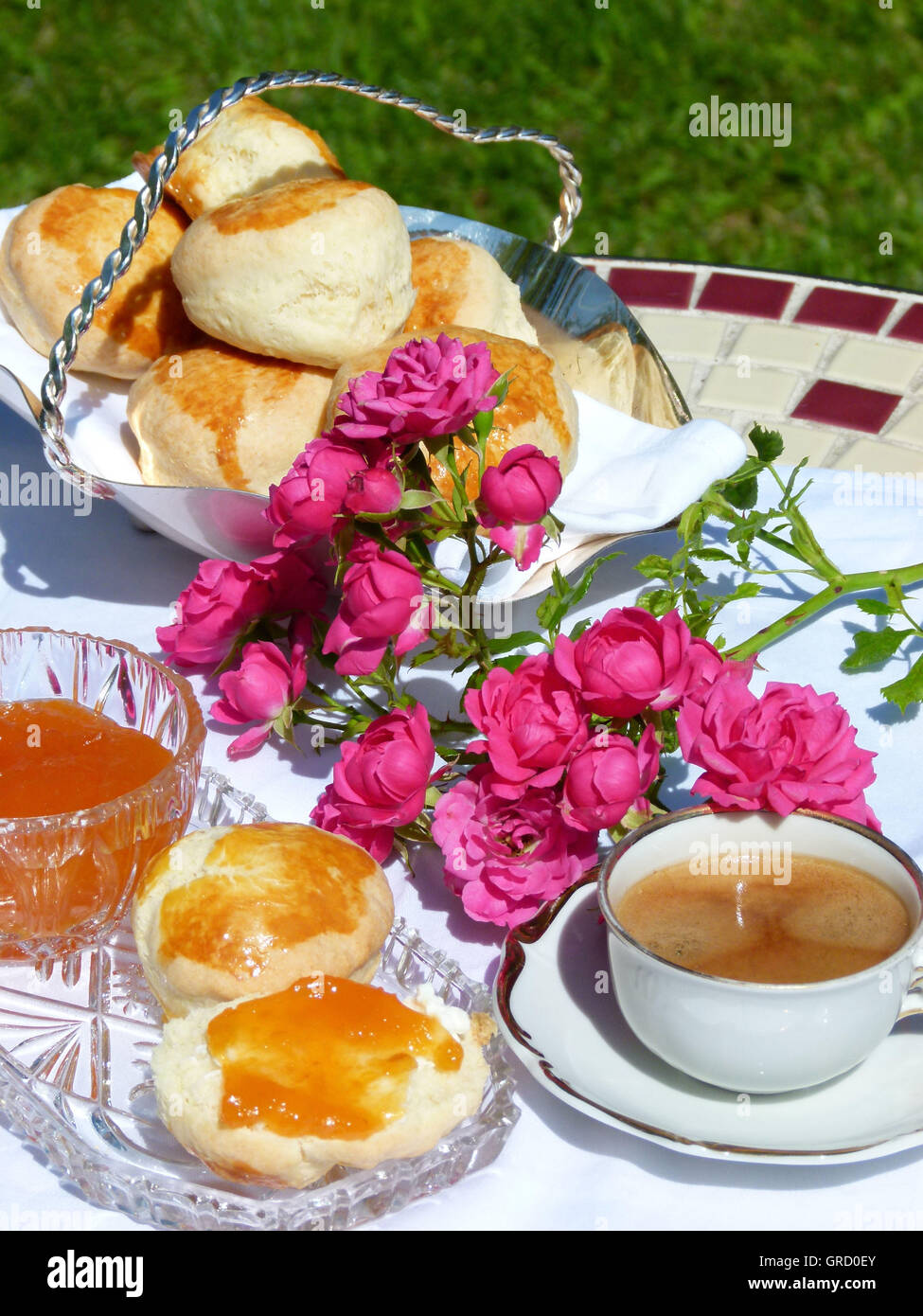 Having Breackfast Outdoor With Homemade Jam And Scones Stock Photo