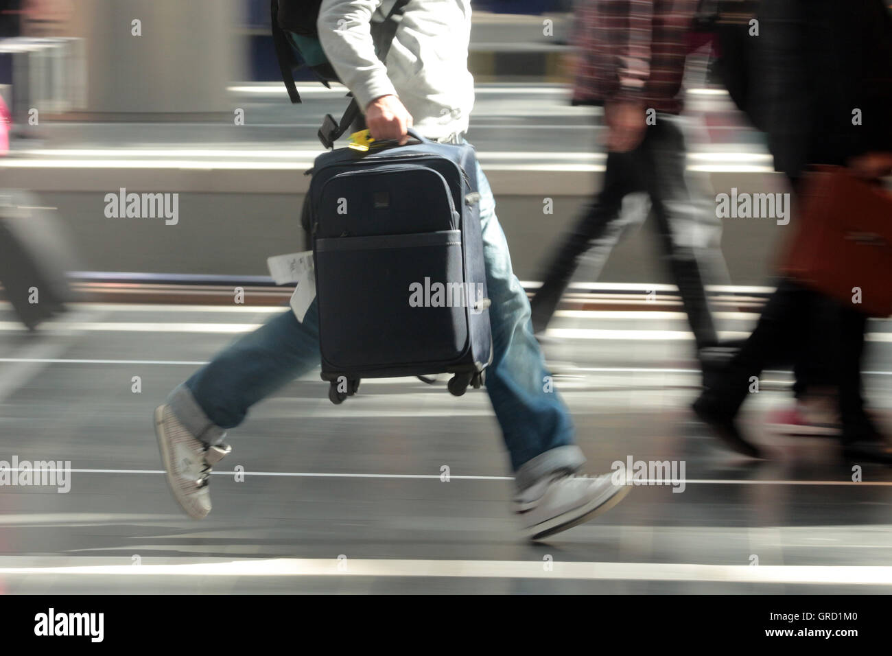 Traveler Rushing To His Train At Railway Station Stock Photo - Alamy