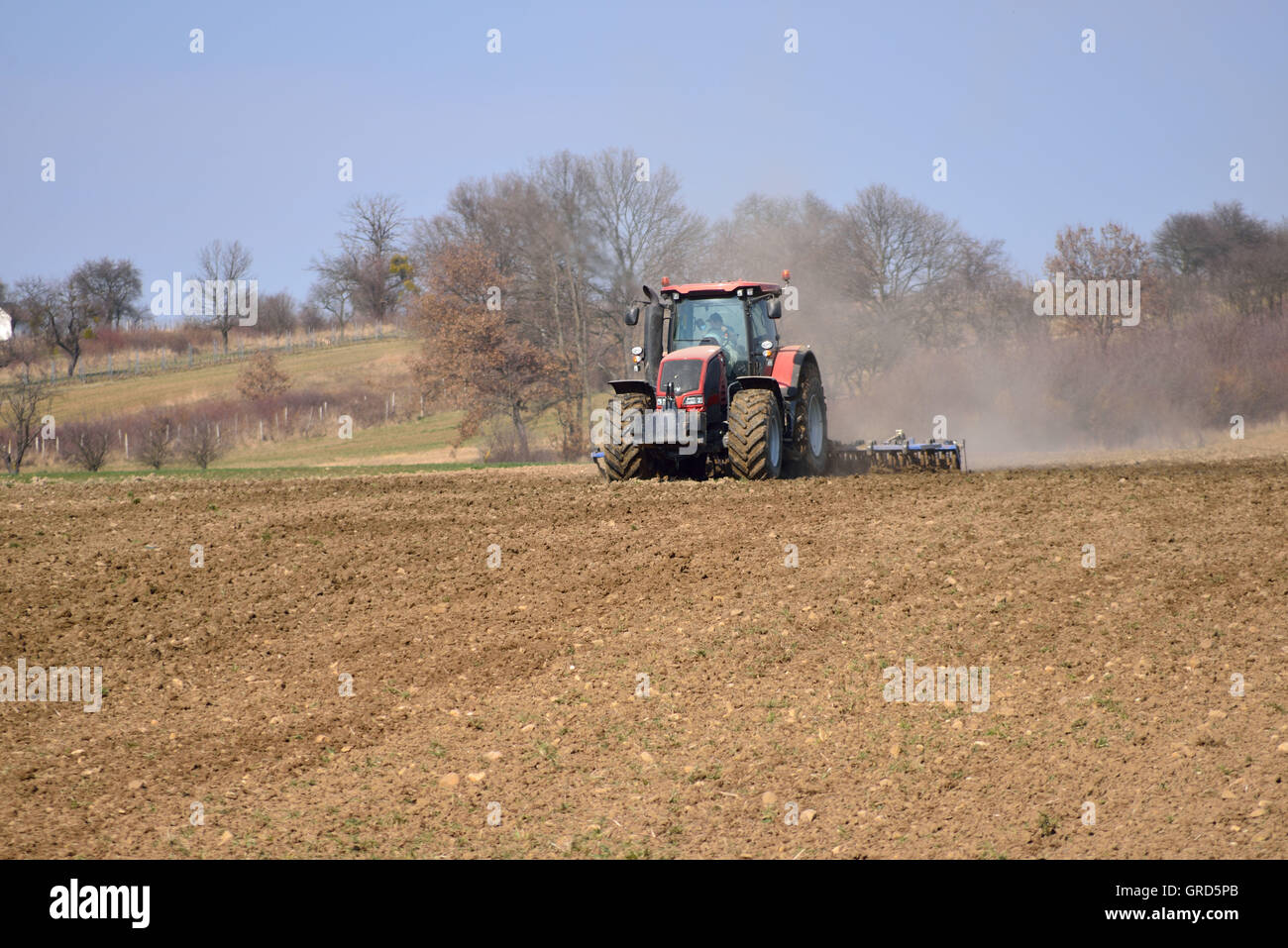 Tractor harrowing hires stock photography and images Alamy