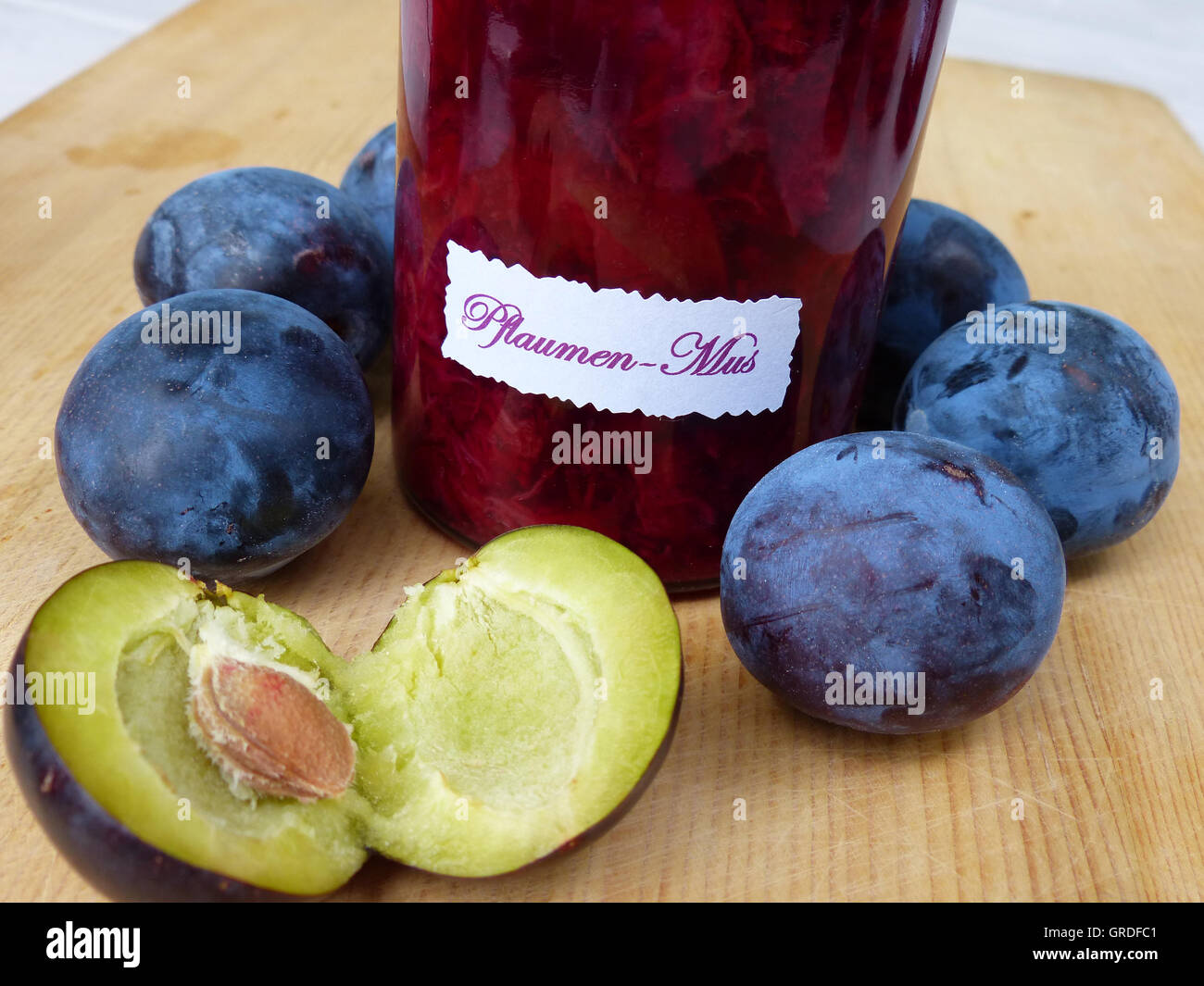 Freshly Cooked Plum Butter And Some Plums Stock Photo Alamy