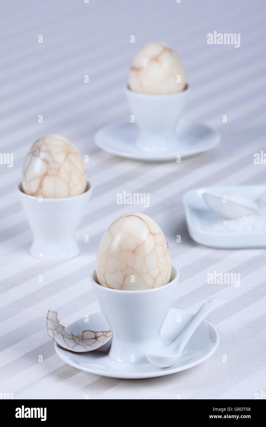 Boiled Eggs With A Marble Pattern On The Surface In An Egg Cup Stock Photo
