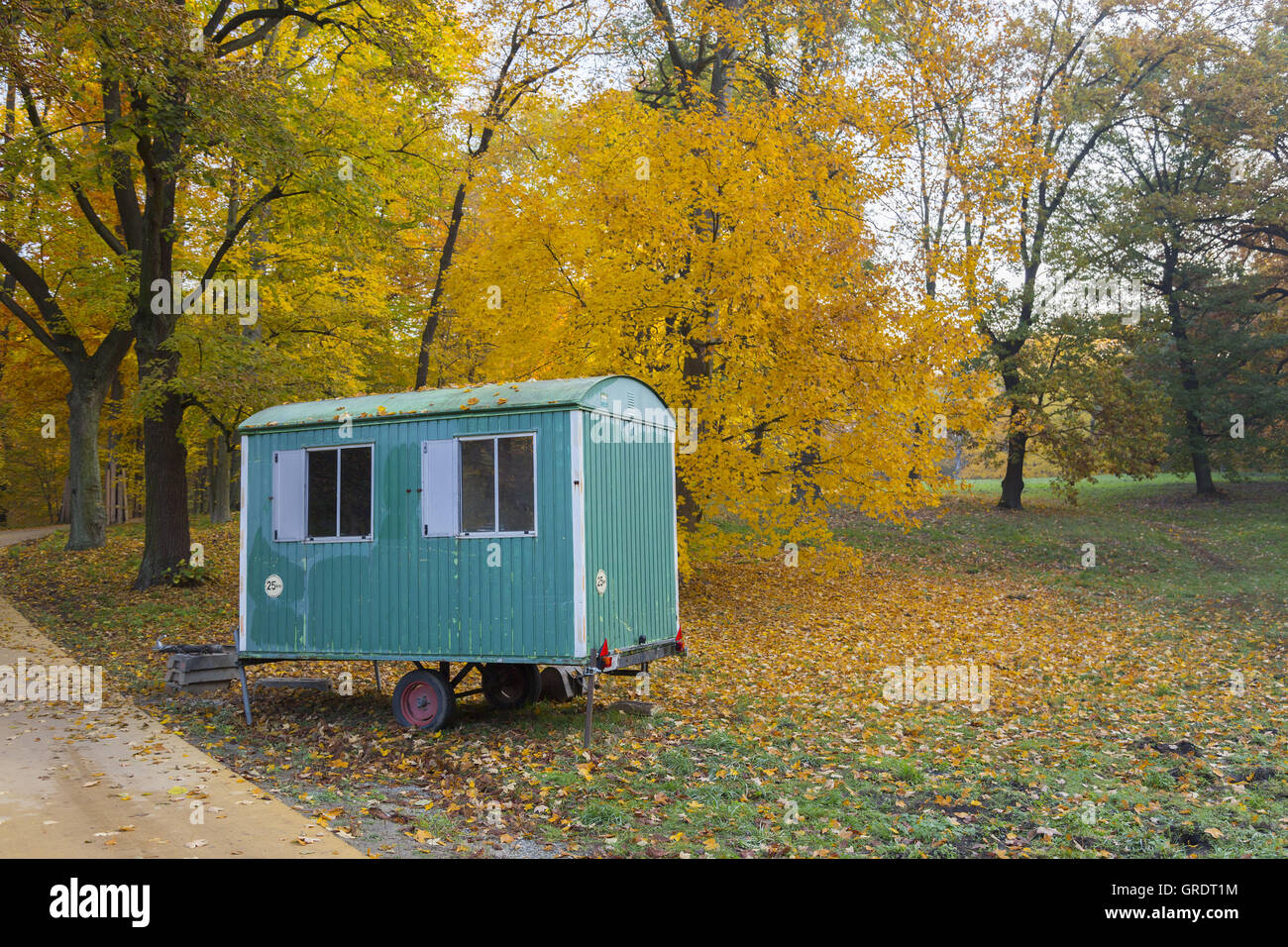 Green Blue Construction Trailer In A Park In Front Of Autumnal Discolored Forest Stock Photo Alamy Green Blue Construction Trailer In A Park In Front Of Autumnal Discolored Forest Stock Photo Alamy