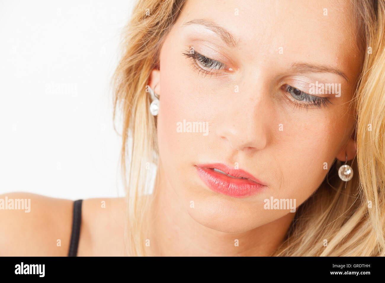 Young Woman With Makeup In Her Face Stock Photo