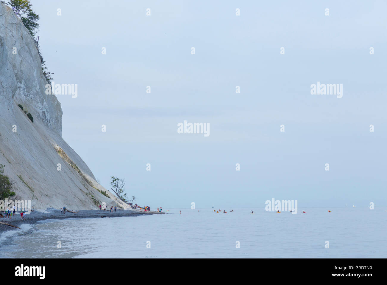 Kayak Fleet At The Foot Of The Limestone Cliffs Of Mons Klint Denmark Stock Photo