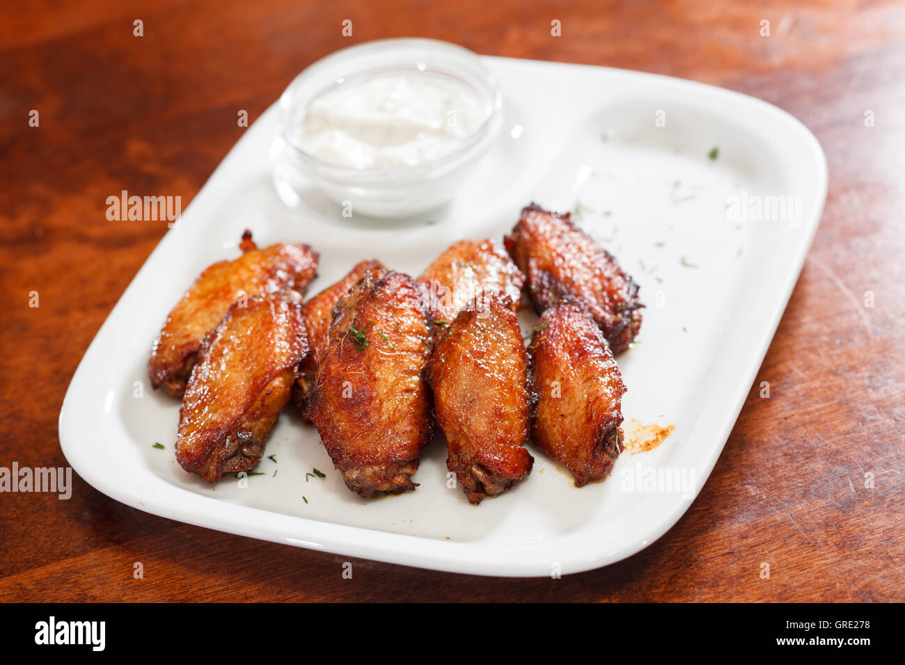 Chicken wings with sauce Stock Photo - Alamy