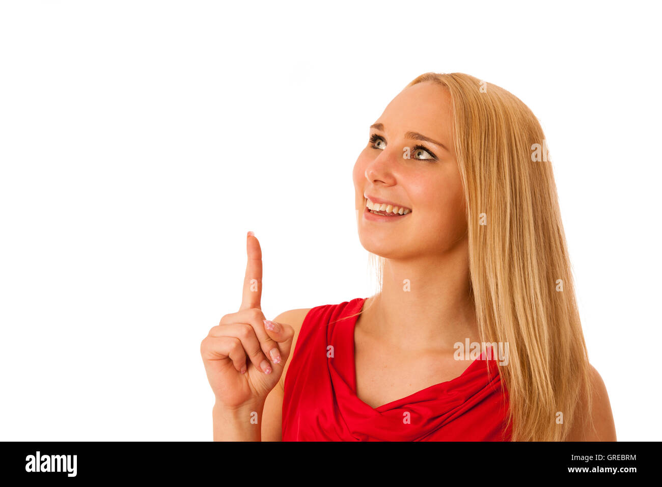 business Woman in red shirt  pointing into copy space isolated over white background for commercial Stock Photo